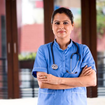 Smiling female nurse at hospital ward